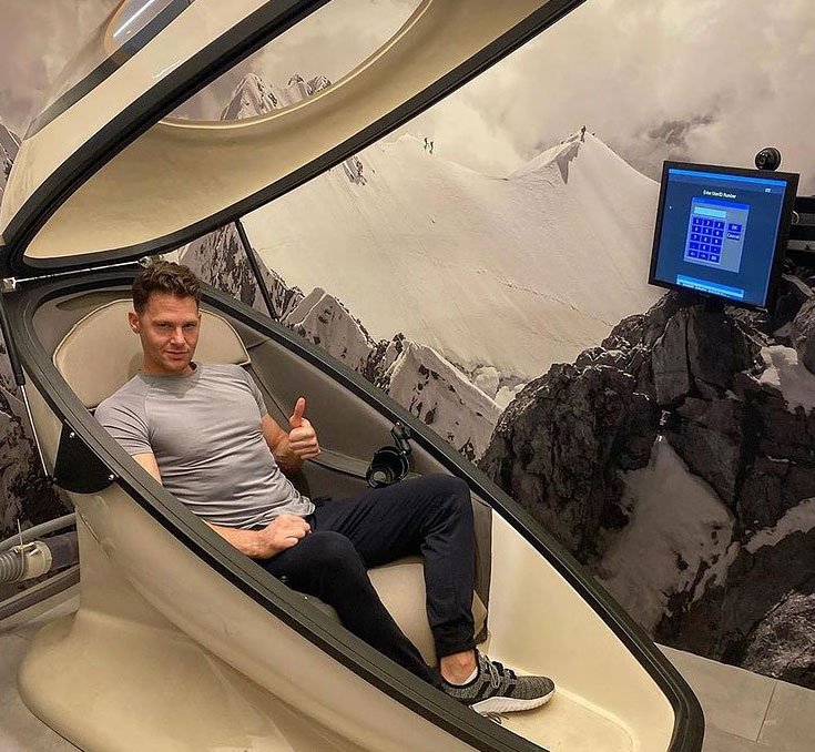 Trainer Joey Thurman climbing into a CVAC Pod at a recovery studio in New York City.