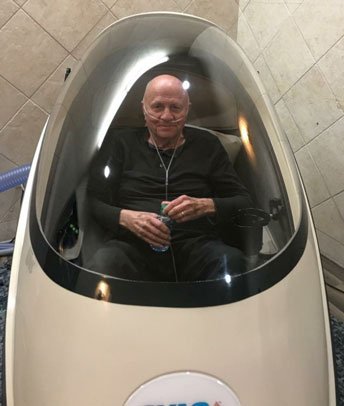Gary, a CVAC client in Texas, standing beside a CVAC Pod.